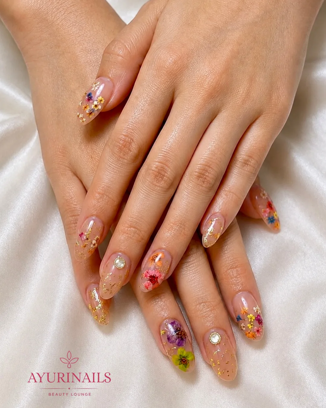 encapsulated multicolour dried pressed flower nails with gold foil on sheer almond extensions, AyuriNails Poblacion Makati